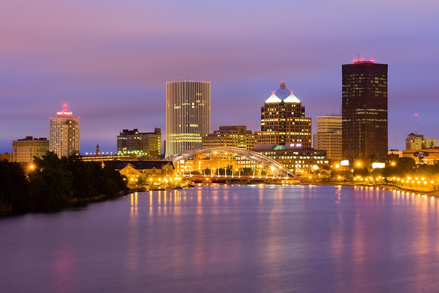 Contact - Rochester, NY Skyline at Night, Lights Reflecting off the Water, Sky Glowing Orange and Deep Purple
